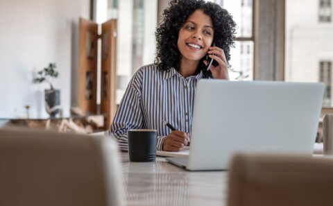 A female employee on a call while working from home