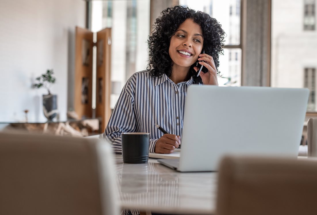 A female employee on a call while working from home