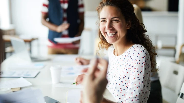 health and safety classic subscription hero image of a woman at an informal meeting in an office