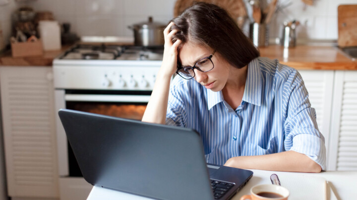 Upset woman working from home office as hero image for article about mental Health Awareness Week 2023