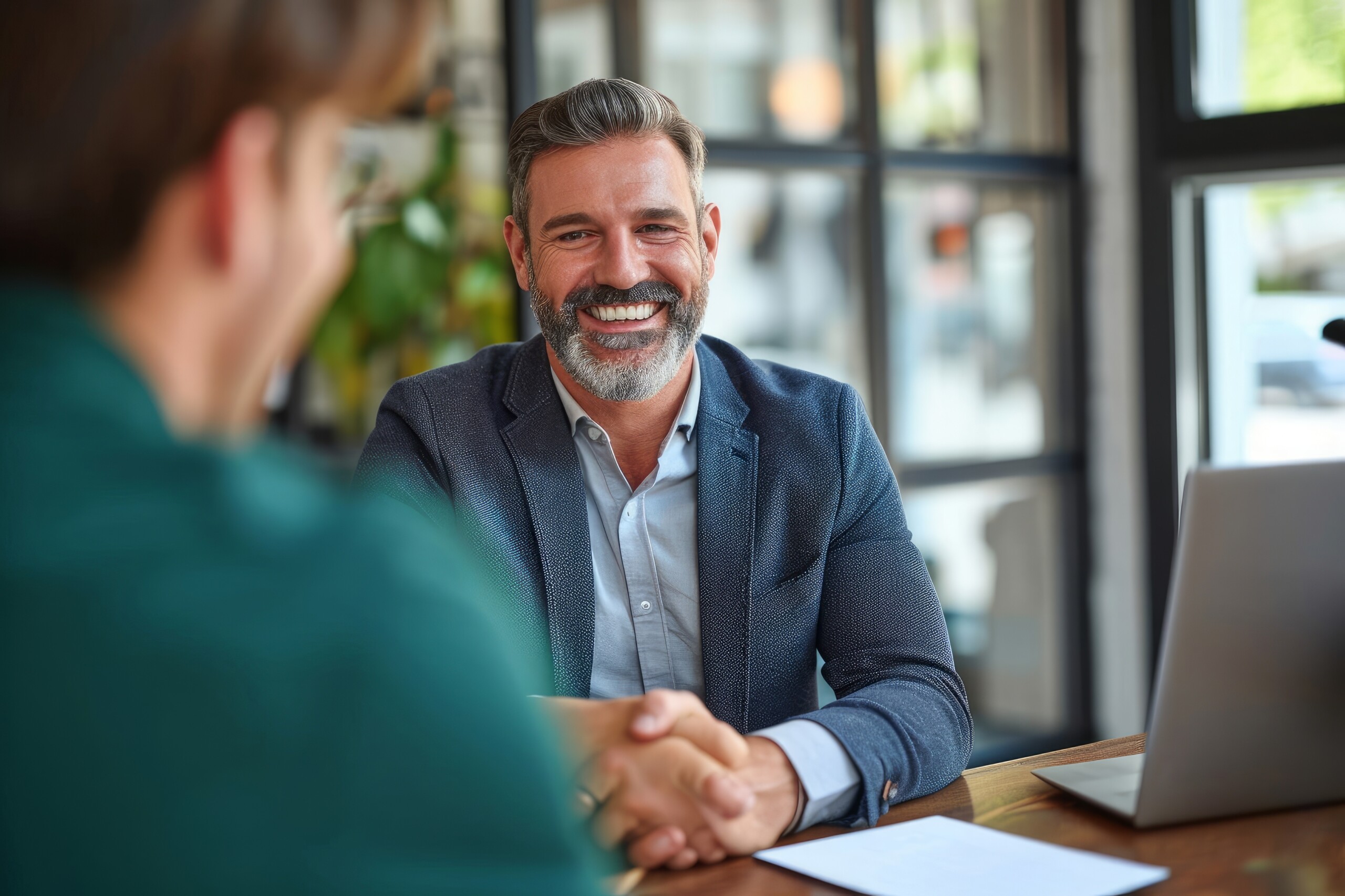 Happy matured businessman in a meeting