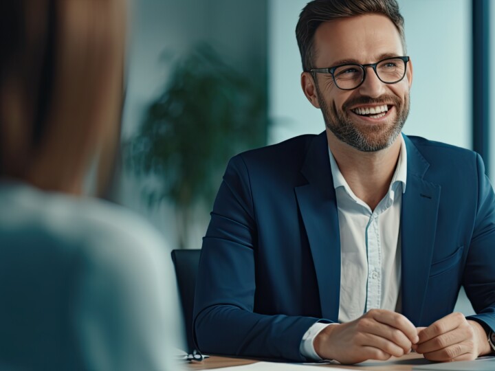 Happy employee smiling during meeting