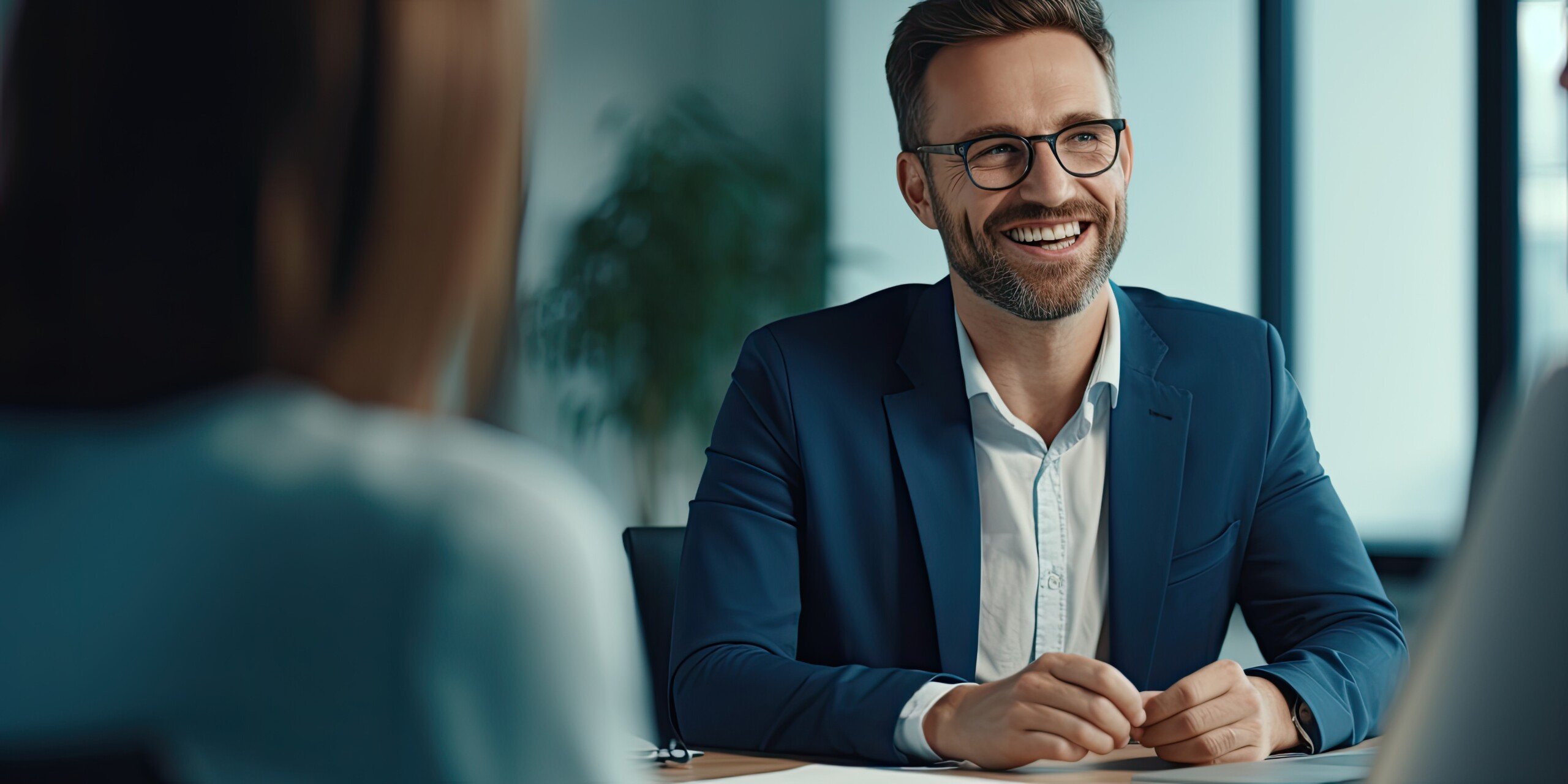 Happy employee smiling during meeting