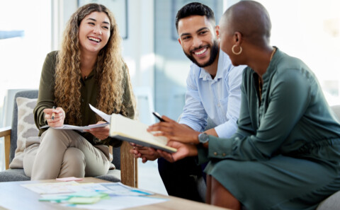 Happy employees smiling during business meeting