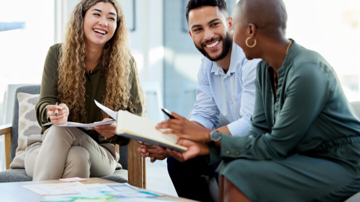 Happy employees smiling during business meeting