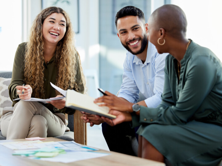 Happy employees smiling during business meeting