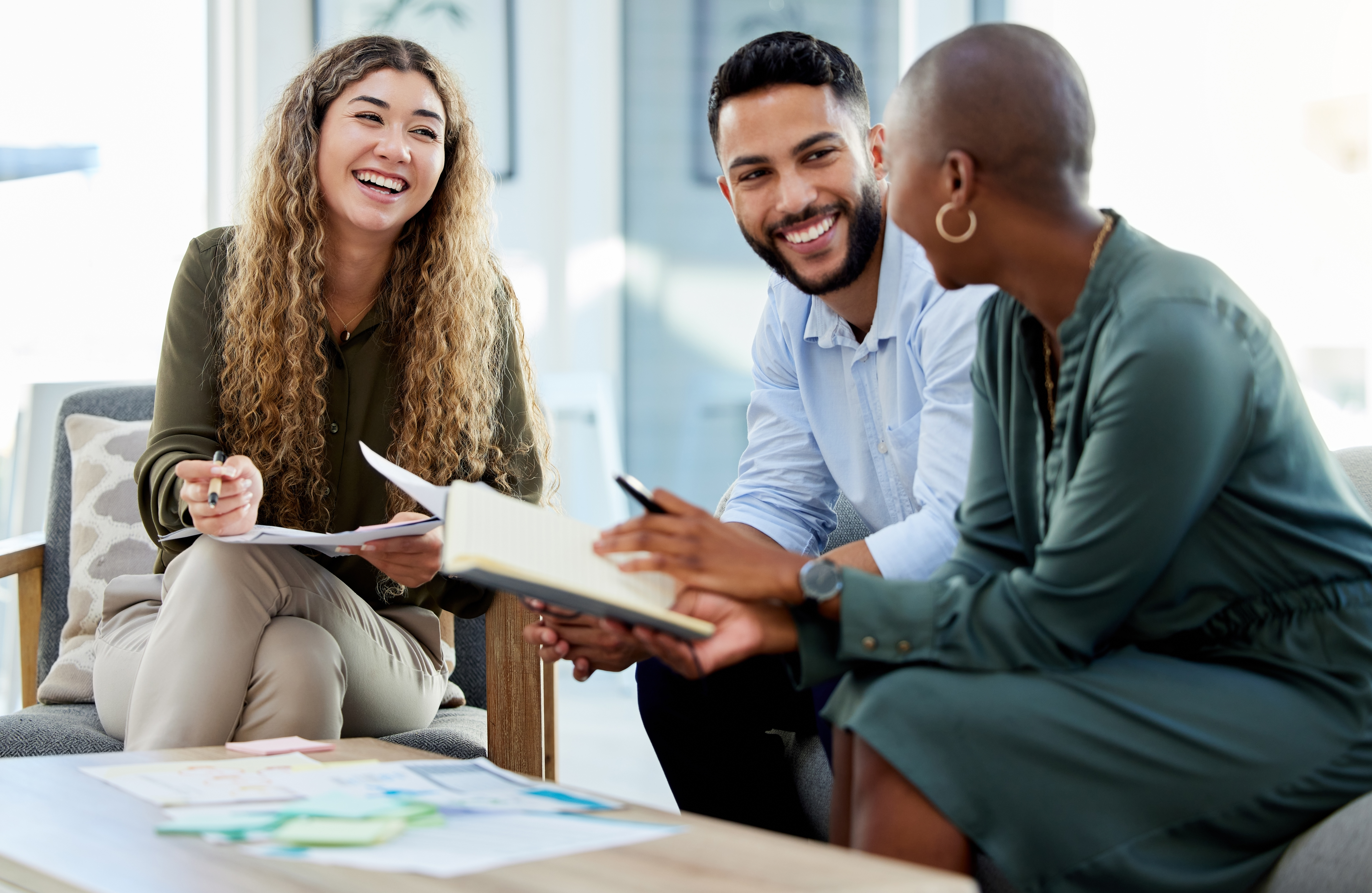 Happy employees smiling during business meeting