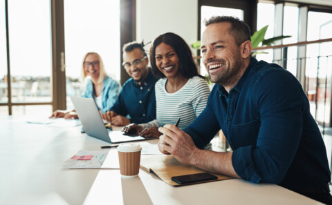 Diverse employees happy during a meeting
