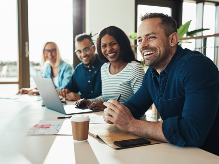 Diverse employees happy during a meeting