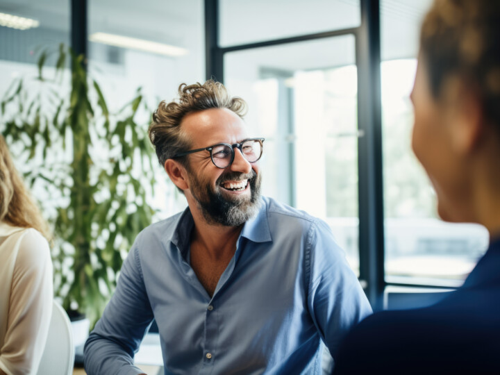 Employee smiling and looking away